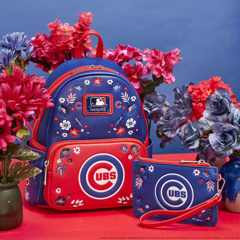 Floral red and blue Loungefly Chicago Cubs mini backpack and wristlet wallet against a blue and red background with blue and red flowers 